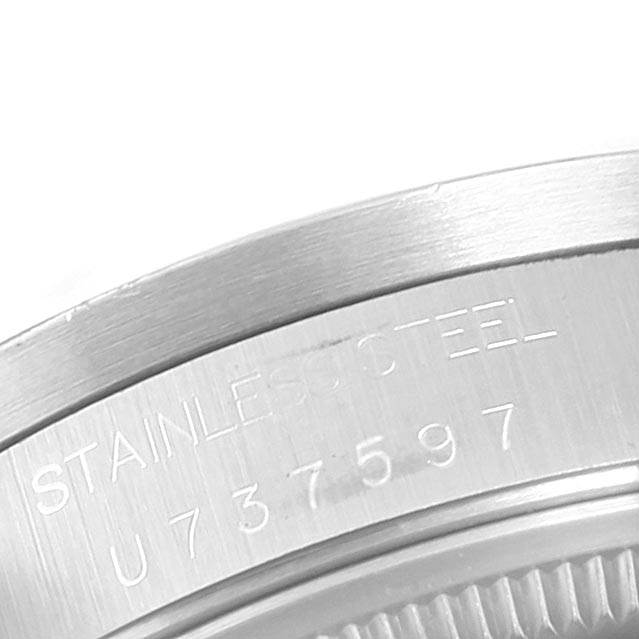 The image shows a close-up of the back case with the serial number engraving on a Rolex Air-King 14010 Men's Stainless Steel Black Dial 14010 Men's Stainless Steel Black Dial watch.