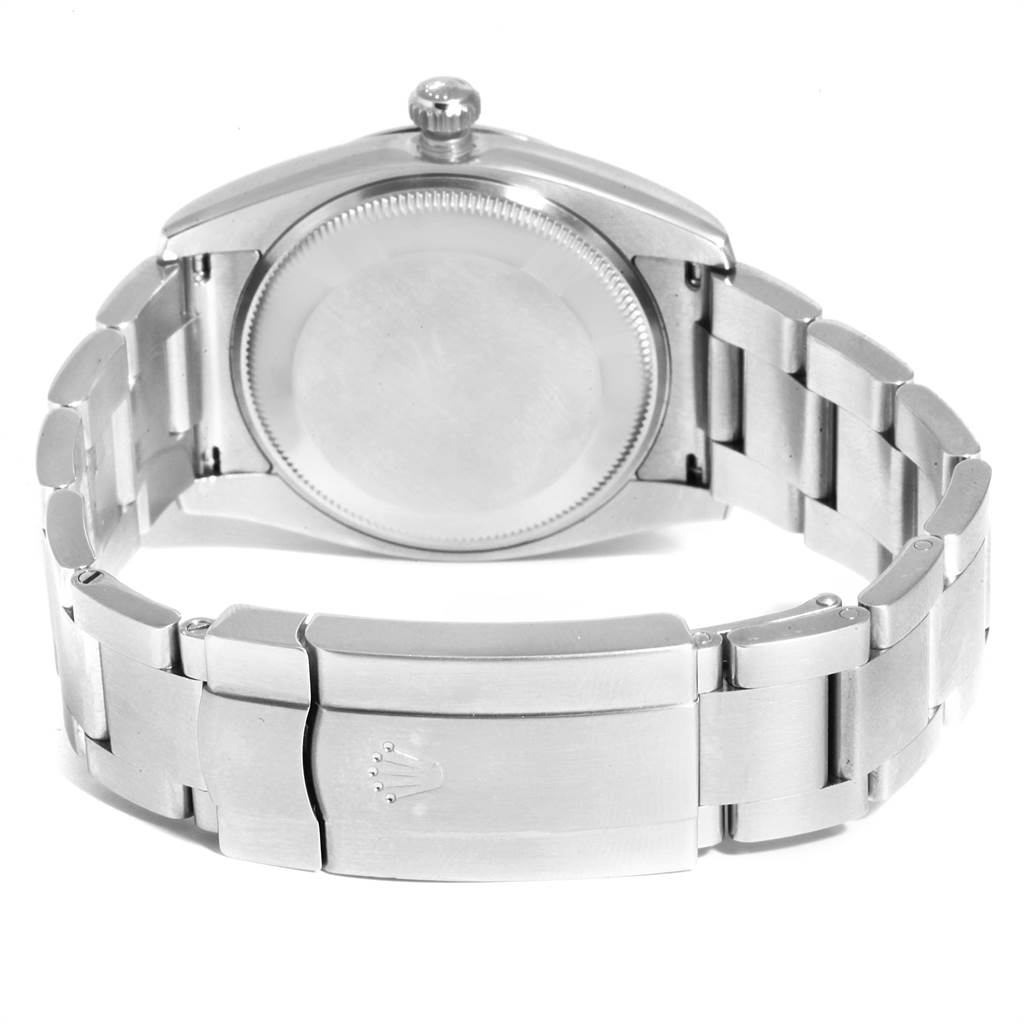 This image shows the back view of a Rolex Air-King 114200 Men's Stainless Steel Blue Dial 114200 Men's Stainless Steel Blue Dial watch focusing on the watch case and bracelet clasp.