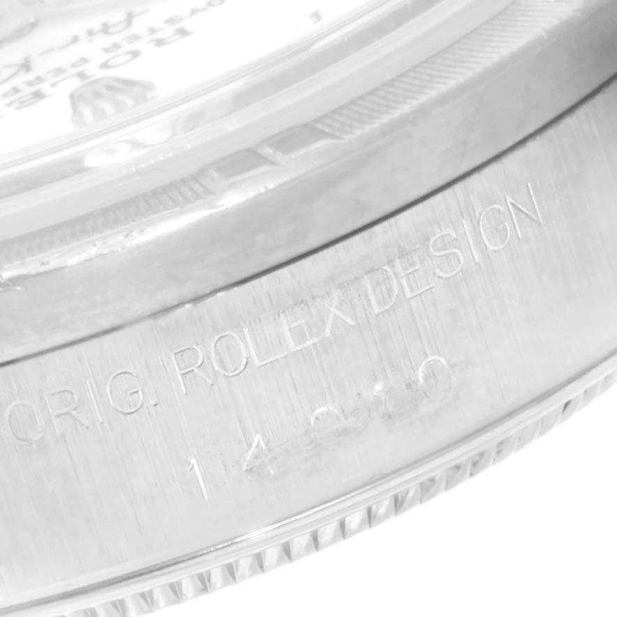 This close-up image shows the side of a Rolex Air-King 14010 Men's Stainless Steel White Dial 14010 Men's Stainless Steel White Dial watch case, highlighting the engraving "ORIG. ROLEX DESIGN."