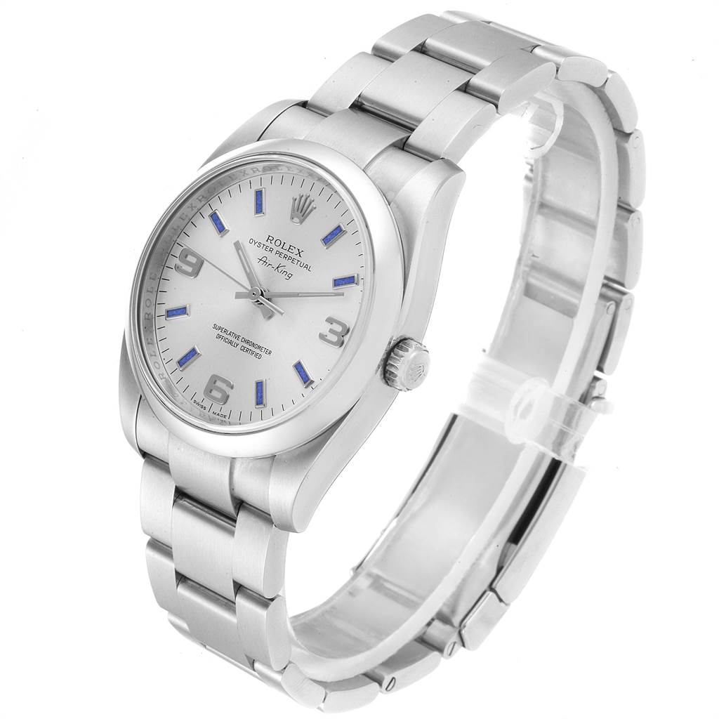 The Rolex Air-King 114200 Men's Stainless Steel Silver Dial 114200 Men's Stainless Steel Silver Dial watch is shown at an angled side view, displaying its face, bezel, and bracelet.