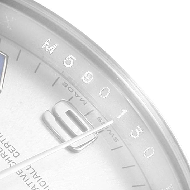 The image shows a close-up of the dial and minute hand of a Rolex Air-King 114200 Men's Stainless Steel Silver Dial 114200 Men's Stainless Steel Silver Dial watch, focusing on the 9 o'clock marker and minute indices.