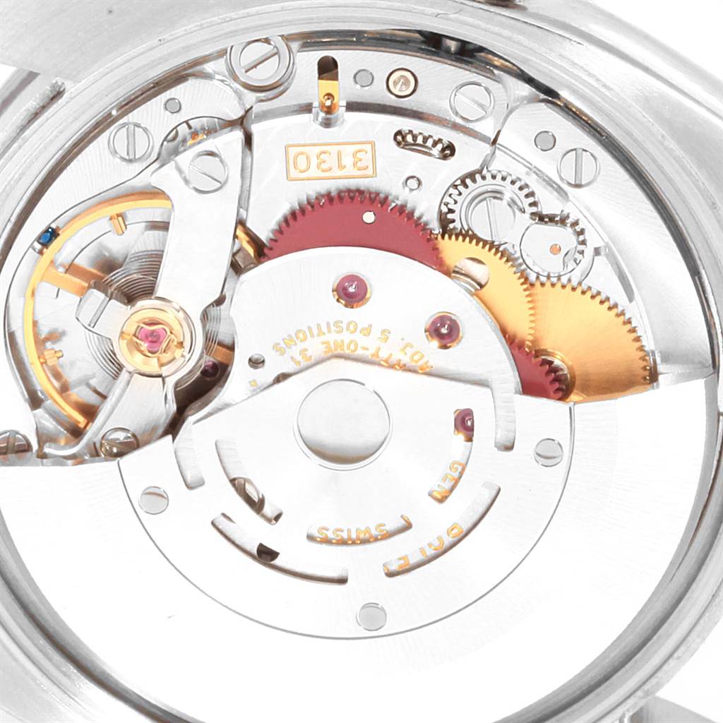 The image shows the intricate internal movement mechanism of a Rolex Air-King 114200 Men's Stainless Steel Silver Dial 114200 Men's Stainless Steel Silver Dial watch, highlighting gears and components.
