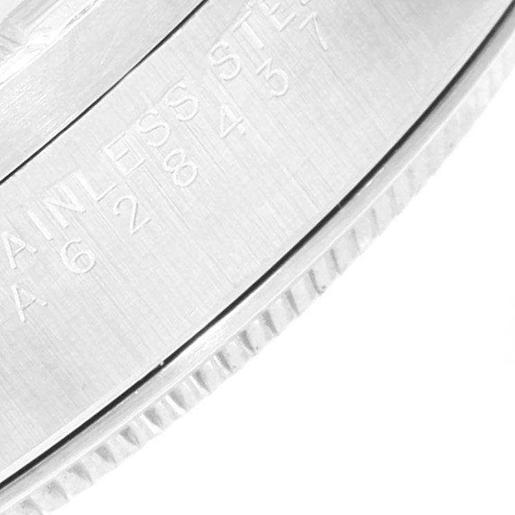 The image shows a close-up view of the engraved side of a Rolex Air-King 14010 Men's Stainless Steel Silver Dial 14010 Men's Stainless Steel Silver Dial watch case.