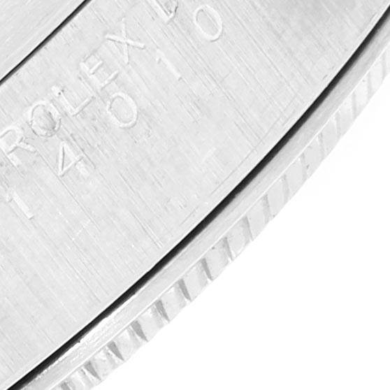 This close-up image shows a partial view of the case back and fluted bezel of the Rolex Air-King 14010 Men's Stainless Steel Silver Dial 14010 Men's Stainless Steel Silver Dial watch.