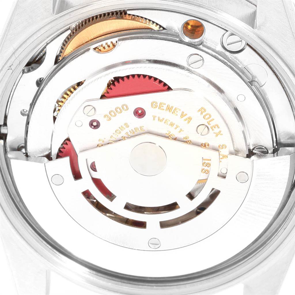 The image shows a close-up of the movement mechanism inside a Rolex Air-King 14010 Men's Stainless Steel Silver Dial 14010 Men's Stainless Steel Silver Dial watch, highlighting the intricate gears and components.