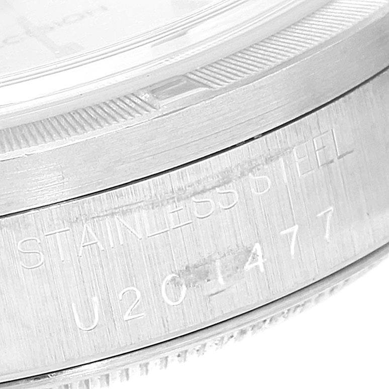 This image shows a close-up angle of the side of a Rolex Air-King 14010 Men's Stainless Steel Silver Dial 14010 Men's Stainless Steel Silver Dial watch, focusing on the stainless steel case with the serial and model numbers engraved.