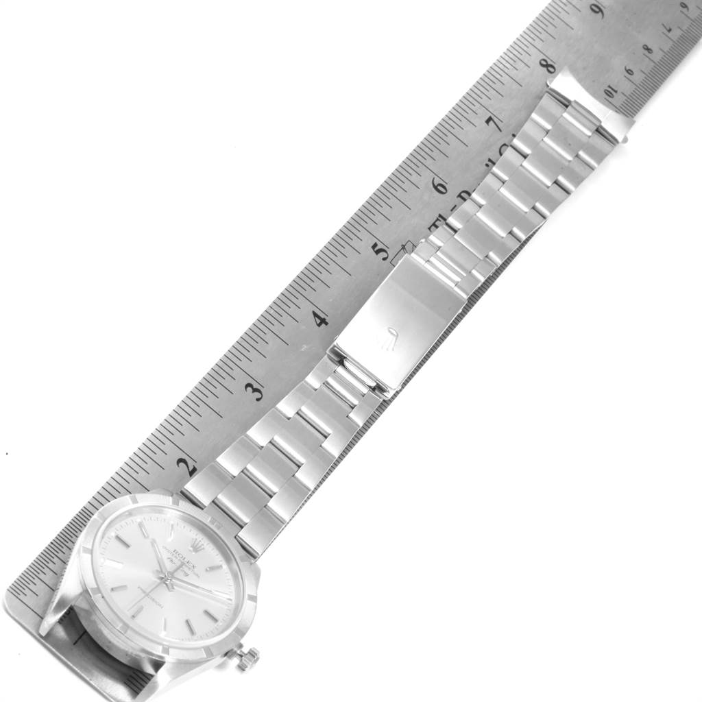 The image shows a Rolex Air-King 14010 Men's Stainless Steel Silver Dial 14010 Men's Stainless Steel Silver Dial watch laid flat alongside a ruler, displaying the face and metallic strap.