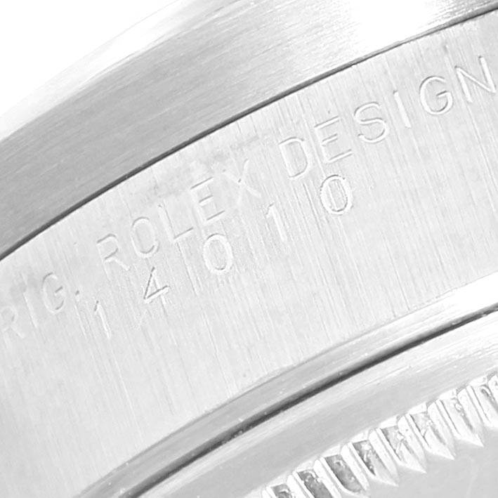 This image shows a close-up of the engraving on the bezel of a Rolex Air-King 14010 Men's Stainless Steel Black Dial 14010 Men's Stainless Steel Black Dial watch.