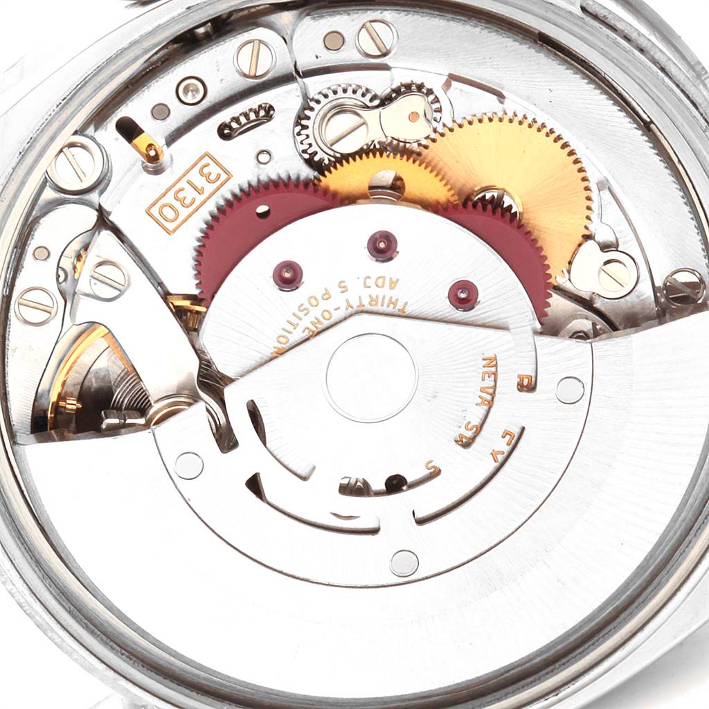 This image shows the internal mechanism of a Rolex 114200 Stainless Steel Silver Dial 114200 Stainless Steel Silver Dial Air King Silver Dial Pink Baton Markers Unisex Watch 114200 model, focusing on its gears and movement.