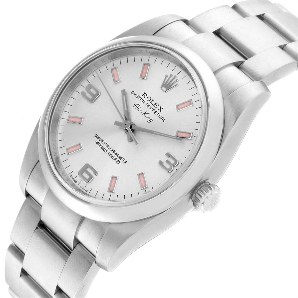 The Rolex 114200 Stainless Steel Silver Dial 114200 Stainless Steel Silver Dial Air King Silver Dial Pink Baton Markers Unisex Watch 114200 is shown at an oblique angle, displaying the watch face, crown, and bracelet.
