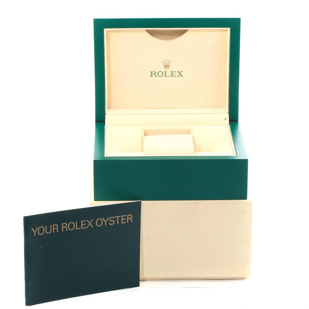 The image shows an open Rolex 114200 Stainless Steel Silver Dial 114200 Stainless Steel Silver Dial watch box and a manual for the Air King Silver Dial Pink Baton Markers Unisex Watch 114200 model.