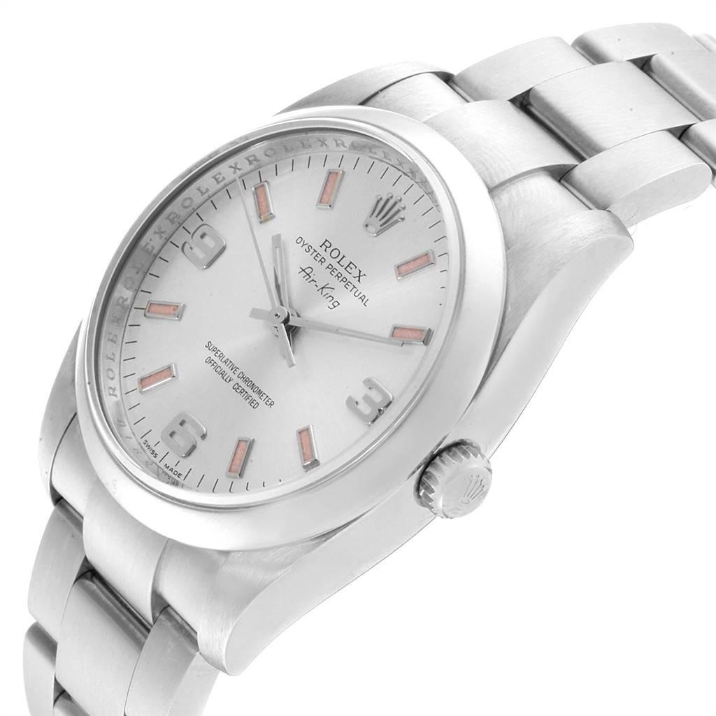 The image shows a side view of the Rolex 114200 Stainless Steel Silver Dial 114200 Stainless Steel Silver Dial Air King Silver Dial Pink Luminous Markers Unisex Watch 114200, highlighting the dial, bezel, bracelet, and crown.