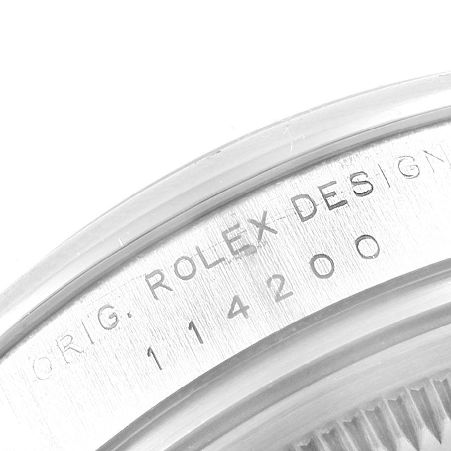 This close-up image shows the engraved model number "114200" and "Rolex 114200 Stainless Steel Silver Dial 114200 Stainless Steel Silver Dial Design" on the Rolex 114200 Stainless Steel Silver Dial 114200 Stainless Steel Silver Dial Air King watch's case.