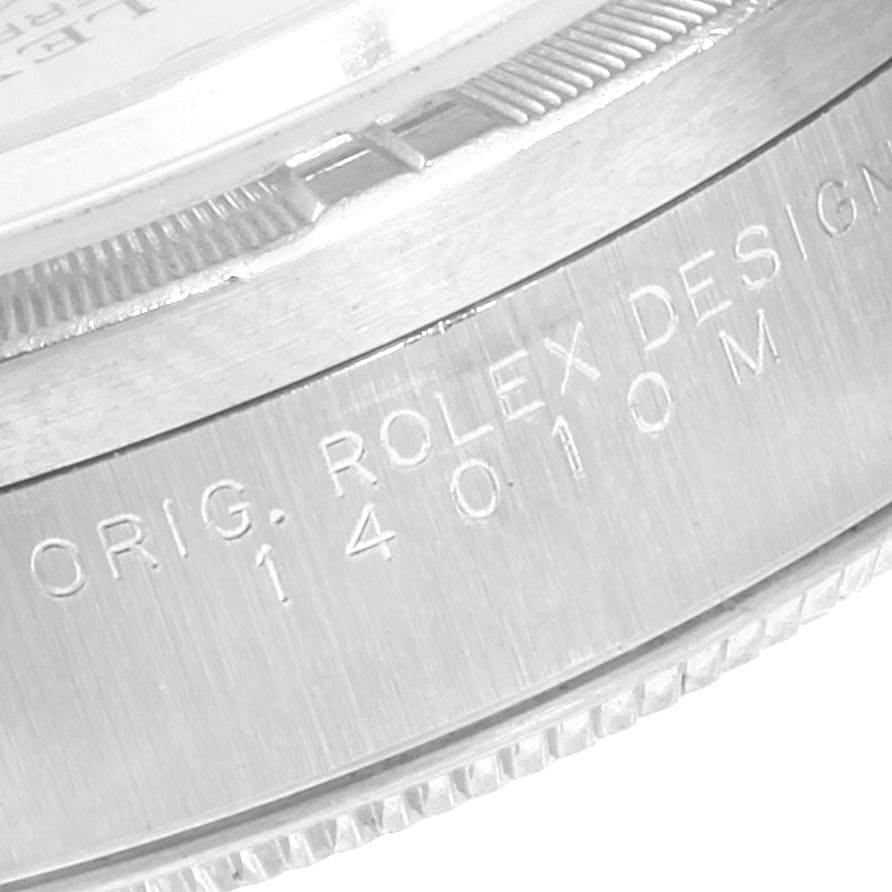 This close-up image shows the engravings on the side of the bezel of a Rolex Air-King 14010 Men's Stainless Steel Silver Dial 14010 Men's Stainless Steel Silver Dial watch.