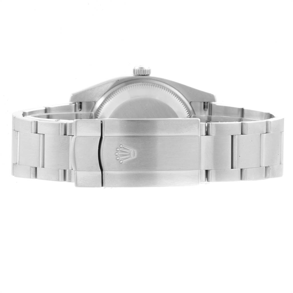 The image shows the back and clasp of a Rolex Air-King 114200 Men's Stainless Steel White Dial 114200 Men's Stainless Steel White Dial watch, highlighting its stainless steel bracelet and Rolex logo.