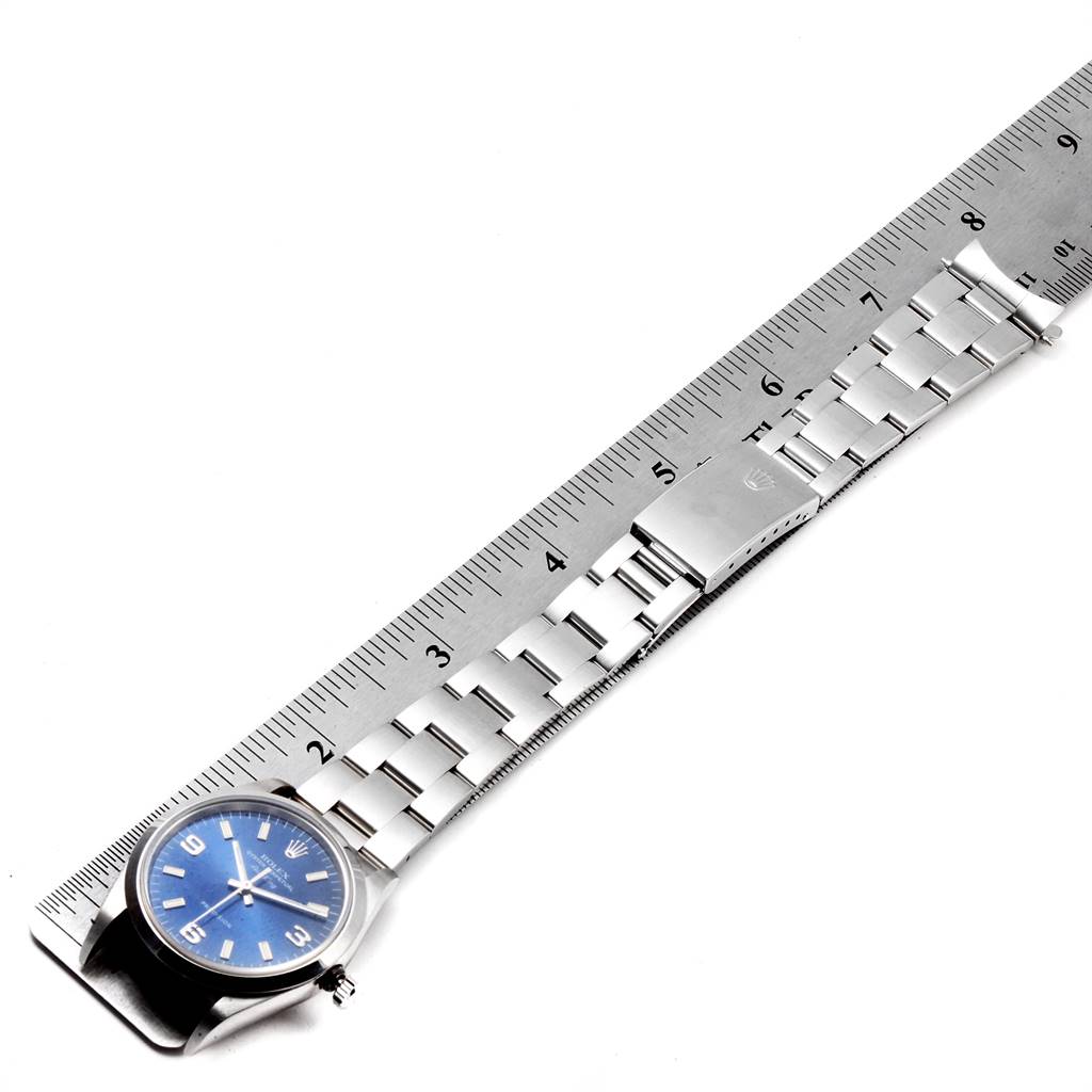 The Rolex Air-King 14000 Men's Stainless Steel Blue Dial 14000 Men's Stainless Steel Blue Dial watch is shown from a top-down angle, with its full bracelet and a ruler for scale.