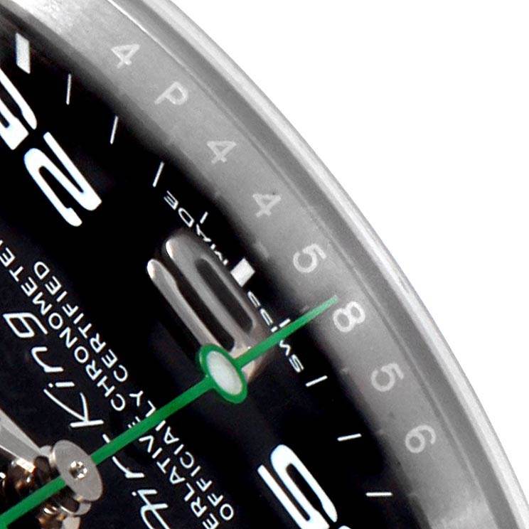 The image shows a close-up of the dial and green second hand of a Rolex Air-King 116900 Men's Stainless Steel Black Dial 116900 Men's Stainless Steel Black Dial watch, highlighting the numerals and the bezel.