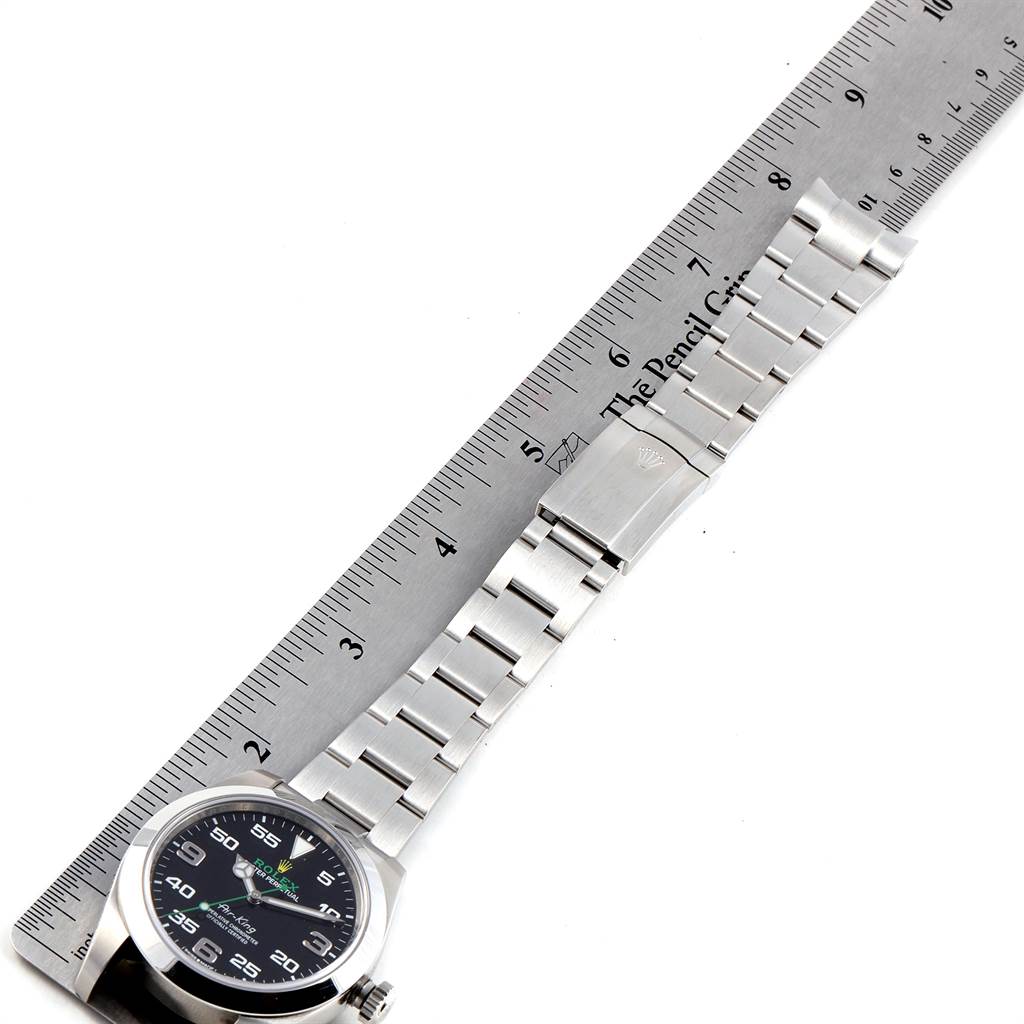 The image shows a top-down view of a Rolex Air-King 116900 Men's Stainless Steel Black Dial 116900 Men's Stainless Steel Black Dial watch, displaying the face and bracelet against a ruler for scale.