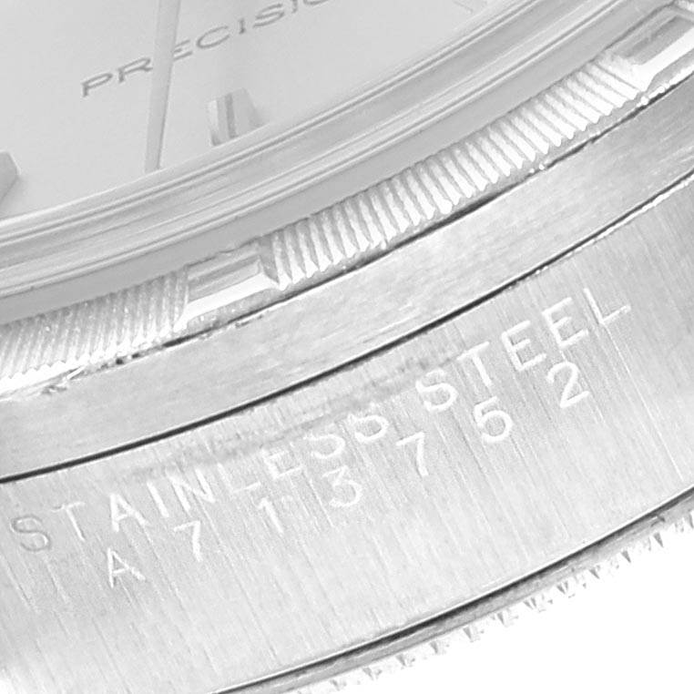 This image shows a close-up of the dial edge, bezel, and engraved caseback of a Rolex Air-King 14010 Men's Stainless Steel Silver Dial 14010 Men's Stainless Steel Silver Dial watch.