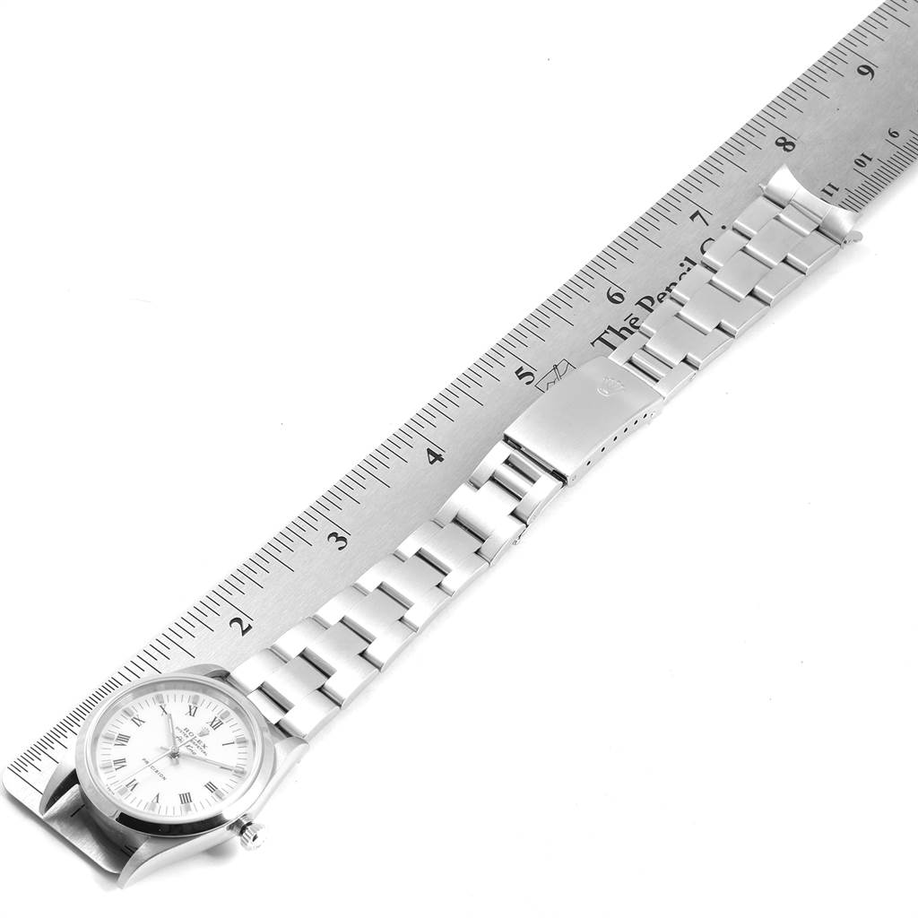 This image shows the Rolex Air-King 14000 Men's Stainless Steel White Dial 14000 Men's Stainless Steel White Dial watch fully extended next to a ruler, highlighting the watch face, bracelet, and clasp.