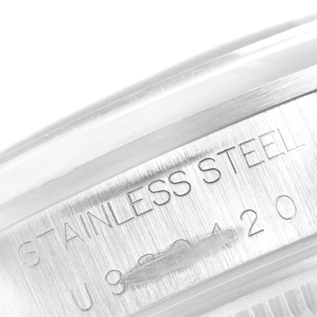 This close-up shows the engraved stainless steel casing of the Rolex Air-King 14000 Men's Stainless Steel White Dial 14000 Men's Stainless Steel White Dial watch.