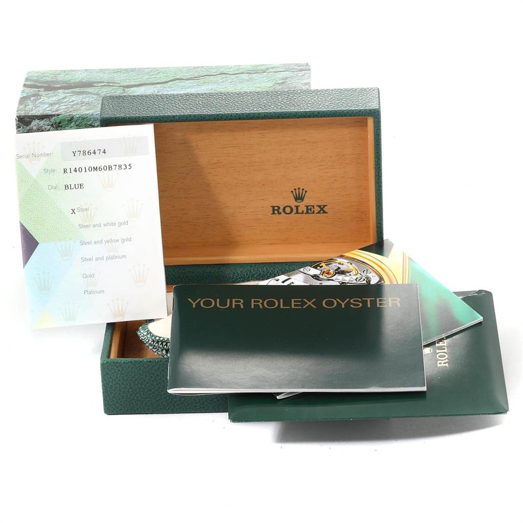 The image shows the open box and accompanying documents for a Rolex Air-King 14010 Men's Stainless Steel Blue Dial 14010 Men's Stainless Steel Blue Dial watch, with the watch partially visible.
