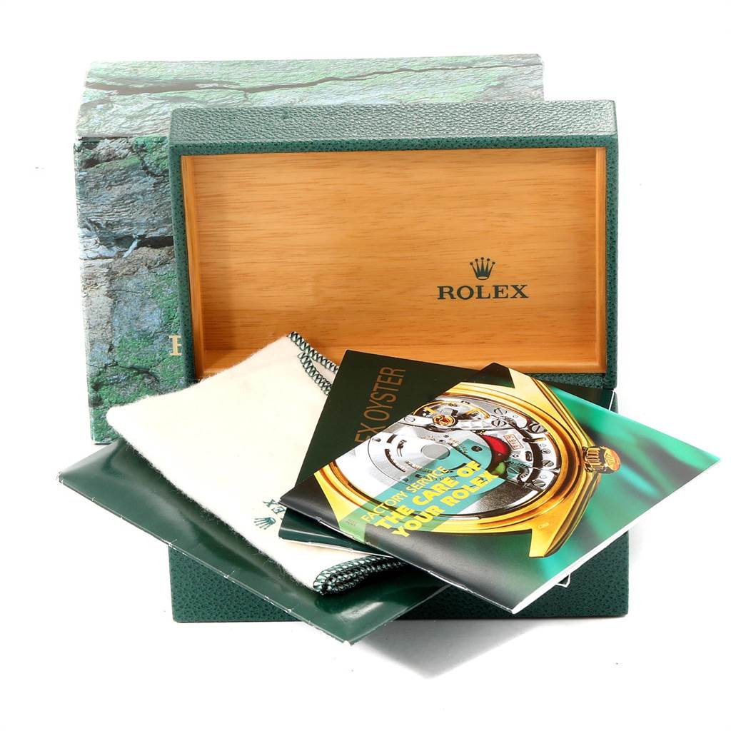 The image shows the accessories and packaging for a Rolex Air-King 14000 Men's Stainless Steel Black Dial 14000 Men's Stainless Steel Black Dial, including the box, manuals, and cloth.