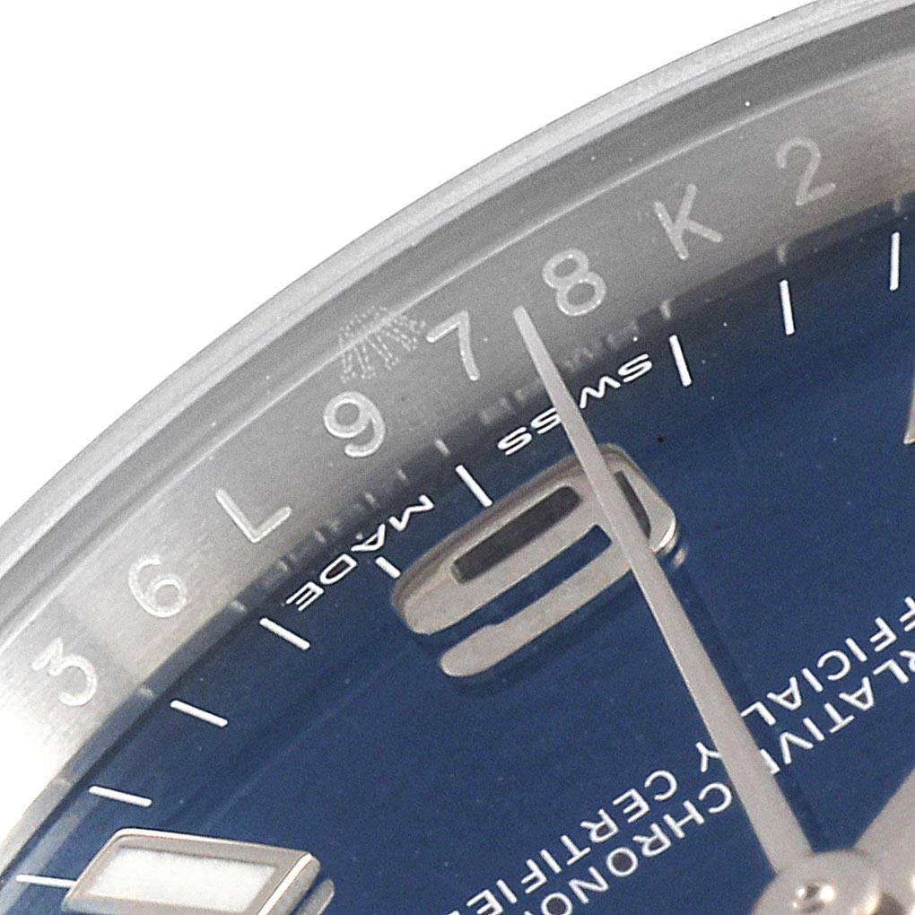 The image shows a close-up view of the dial and second hand of a Rolex Air-King 114200 Men's Stainless Steel Blue Dial 114200 Men's Stainless Steel Blue Dial watch, focusing on the numerals and part of the minute markers.