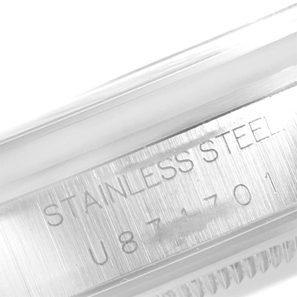 The image shows a close-up of the side inscription "STAINLESS STEEL" with serial number on the Rolex Air-King 14000 Men's Stainless Steel Blue Dial 14000 Men's Stainless Steel Blue Dial.