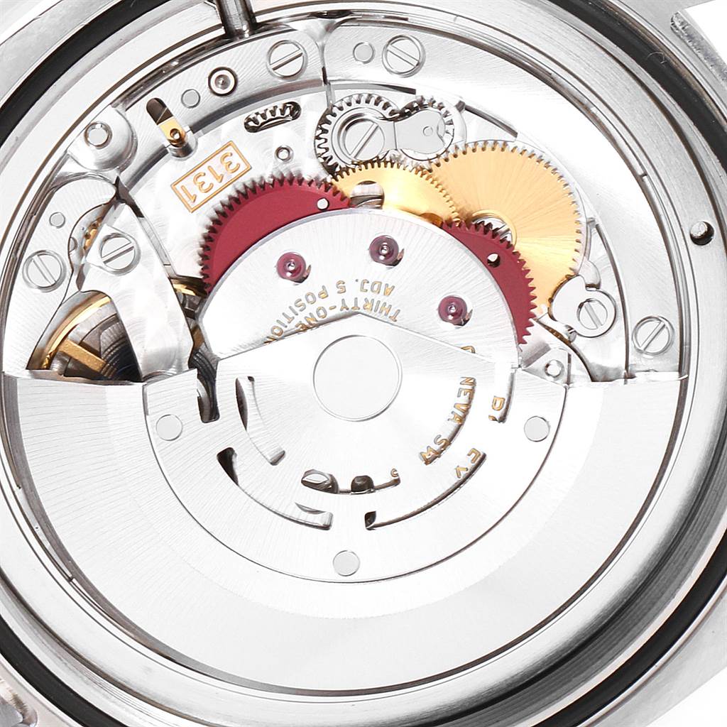 This image shows a close-up of the Rolex Air-King 116900 Men's Stainless Steel Black Dial 116900 Men's Stainless Steel Black Dial's exposed internal mechanism and gears from the back angle.