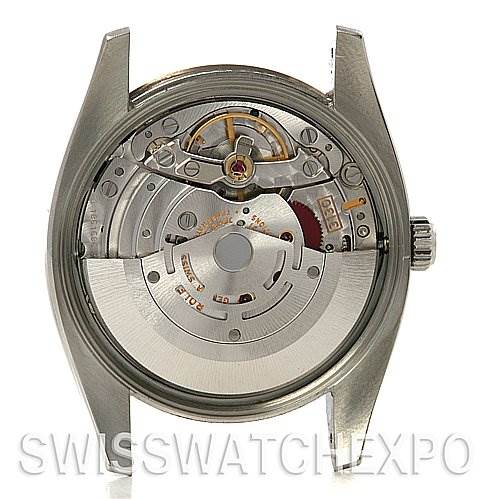 The image shows the back view of a Rolex Air-King 114234 Stainless Steel Silver Dial 114234 Stainless Steel Silver Dial watch, revealing its internal movement and mechanism.