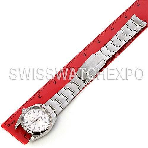 This image shows a Rolex Air-King 114234 Stainless Steel Silver Dial 114234 Stainless Steel Silver Dial watch laid flat next to a red ruler, displaying the watch face and full bracelet link.