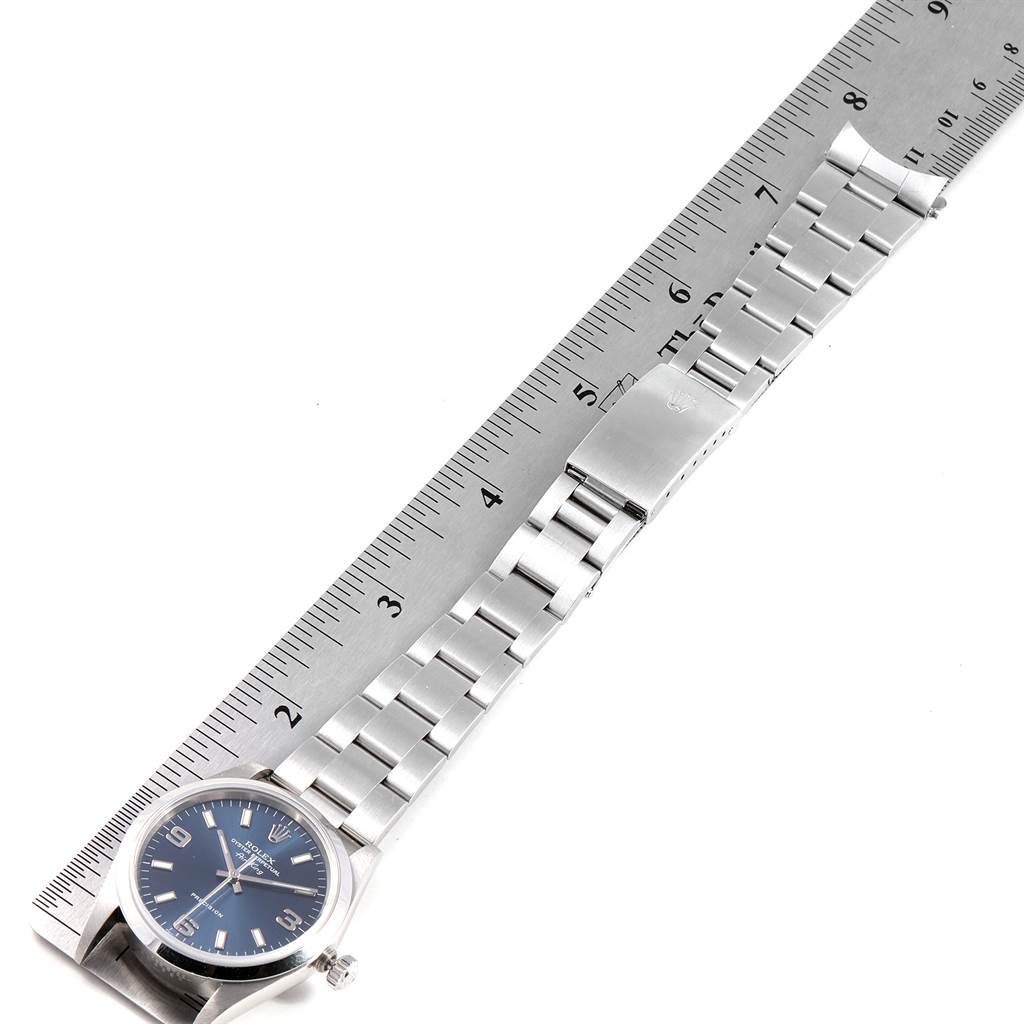 The Rolex Air-King 14000 Men's Stainless Steel Blue Dial 14000 Men's Stainless Steel Blue Dial watch is shown from a top-down angle with a ruler adjacent to measure the watch band length.
