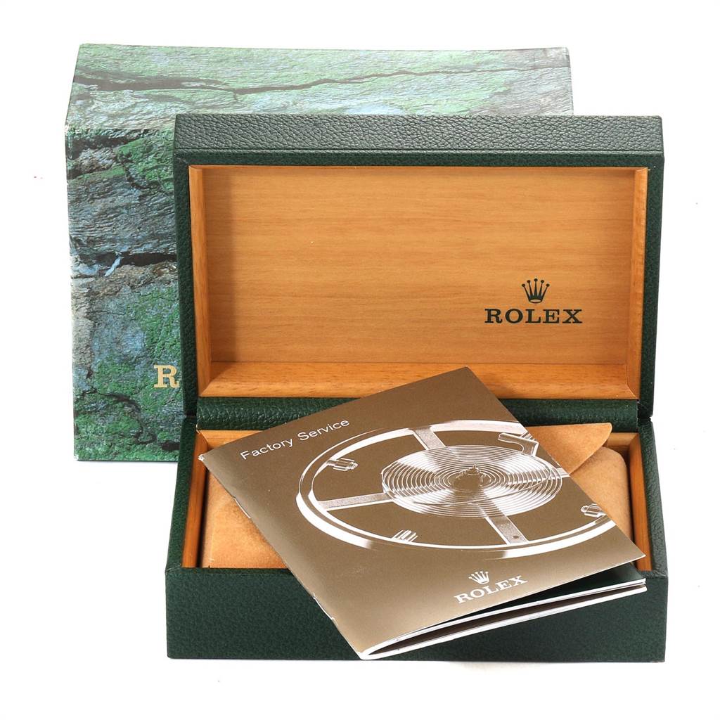 An empty Rolex Air-King 14000 Men's Stainless Steel Blue Dial 14000 Men's Stainless Steel Blue Dial box with a factory service booklet.