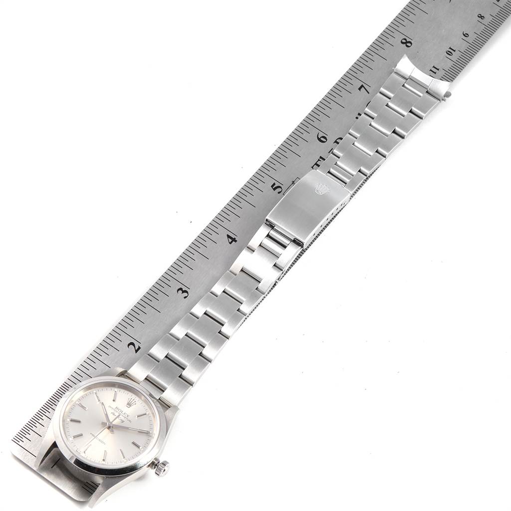 The image shows a Rolex Air-King 14000 Men's Stainless Steel Silver Dial 14000 Men's Stainless Steel Silver Dial watch laid flat alongside a ruler, highlighting the watch face, bracelet, and clasp.