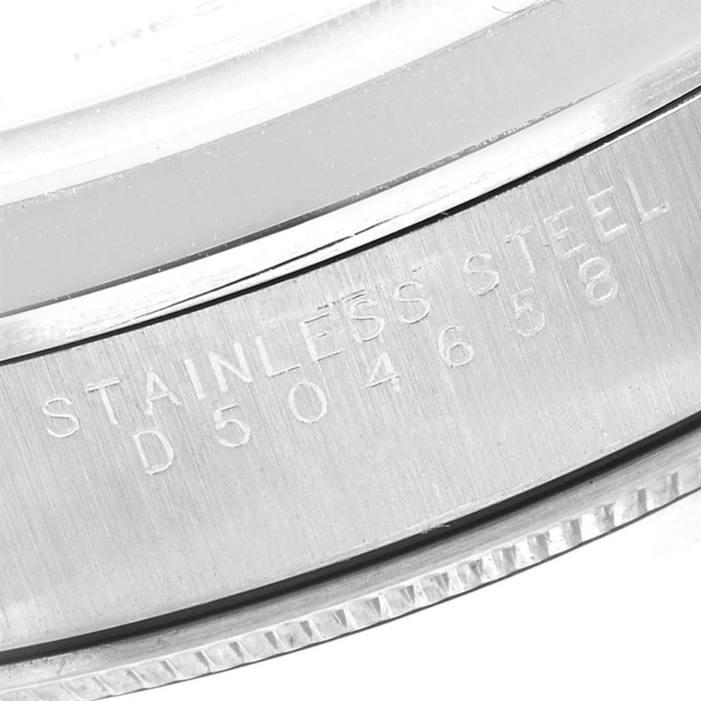 This image shows a close-up of the stainless steel engraving and serial number on the case of a Rolex Air-King 14000 Men's Stainless Steel Silver Dial 14000 Men's Stainless Steel Silver Dial watch.