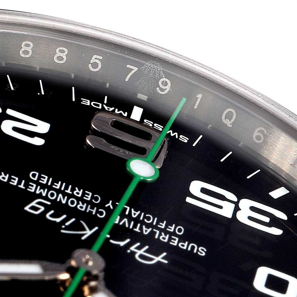 Close-up of the Rolex Air-King 116900 Men's Stainless Steel Black Dial 116900 Men's Stainless Steel Black Dial watch showing part of the bezel, dial, and green seconds hand.