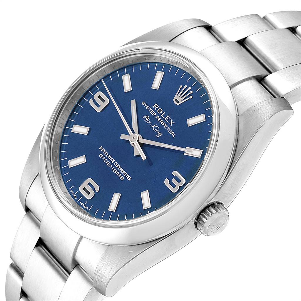 The image shows a Rolex Air-King 114200 Men's Stainless Steel Blue Dial 114200 Men's Stainless Steel Blue Dial watch viewed from an angled perspective highlighting the face, bezel, crown, and part of the bracelet.