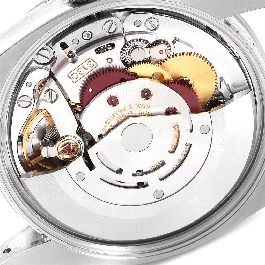 The image shows the internal mechanism of a Rolex Air-King 114210 Men's Stainless Steel White Dial 114210 Men's Stainless Steel White Dial watch, featuring gears and the rotor from an angled view.
