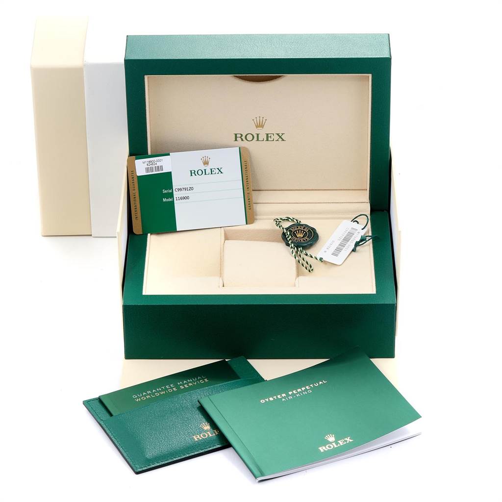 The image shows the accessories and packaging for a Rolex Air-King 116900 Men's Stainless Steel Black Dial 116900 Men's Stainless Steel Black Dial watch, including the box, tag, manuals, and warranty card.