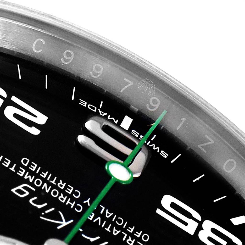 The image shows a close-up of the dial of a Rolex Air-King 116900 Men's Stainless Steel Black Dial 116900 Men's Stainless Steel Black Dial watch, focusing on the 9 o'clock marker, the green second hand, and the "Swiss Made" text.