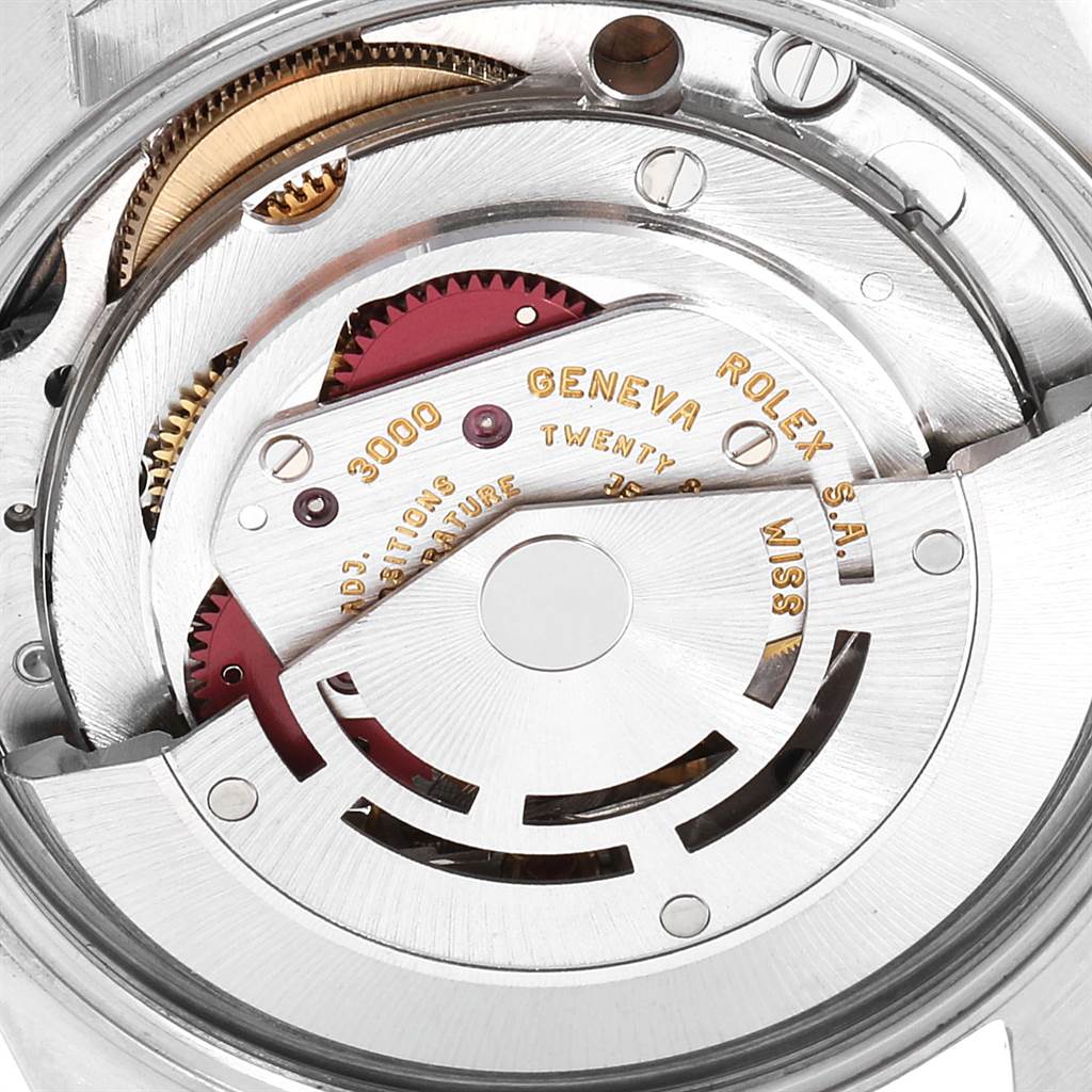 This image shows a close-up view of the movement and inner workings of a Rolex Air-King 14010 Men's Stainless Steel Pink Dial 14010 Men's Stainless Steel Pink Dial watch.