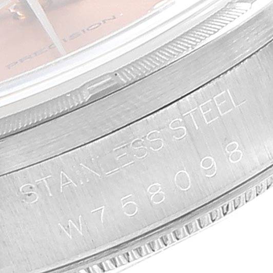 This close-up image shows the side of the stainless steel case and partial dial of a Rolex Air-King 14010 Men's Stainless Steel Pink Dial 14010 Men's Stainless Steel Pink Dial watch, revealing its serial number.