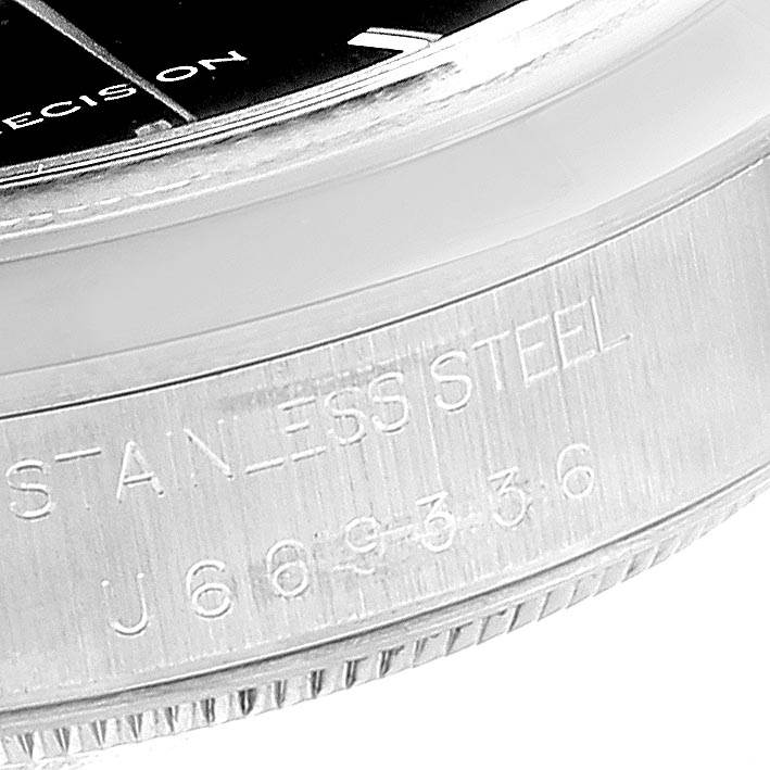 This close-up image shows the side casing of the Rolex Air-King 14000 Men's Stainless Steel Black Dial 14000 Men's Stainless Steel Black Dial watch with "STAINLESS STEEL" engraved.