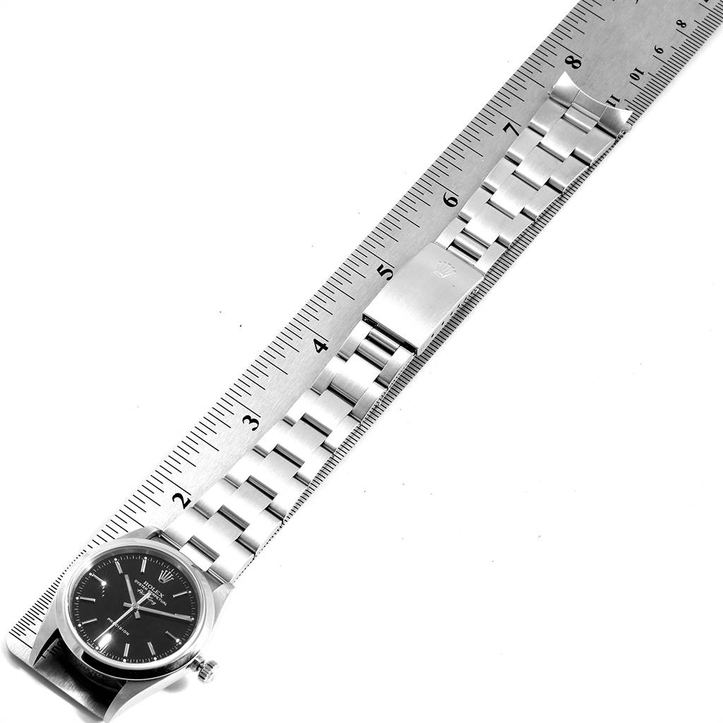The image shows a Rolex Air-King 14000 Men's Stainless Steel Black Dial 14000 Men's Stainless Steel Black Dial watch laid flat alongside a ruler, highlighting its bracelet and clasp.