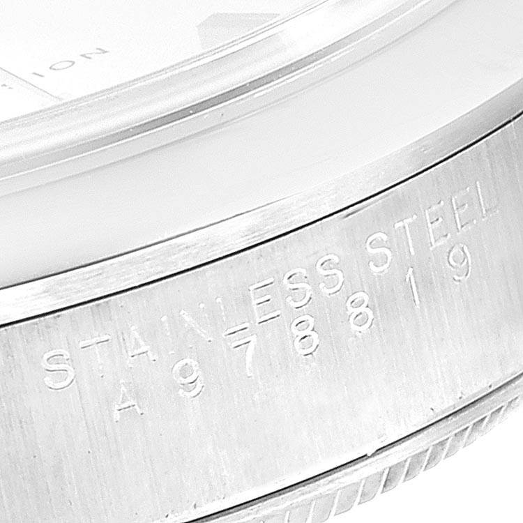 This close-up image shows the side of a Rolex Air-King 14000 Men's Stainless Steel Silver Dial 14000 Men's Stainless Steel Silver Dial watch, focusing on the stainless steel case with engraved details.
