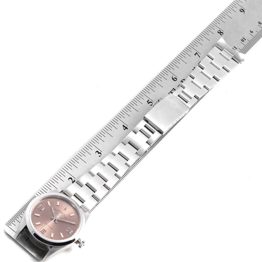 The Rolex Air-King 14000 Men's Stainless Steel Pink Dial 14000 Men's Stainless Steel Pink Dial watch is shown lying flat, with its bracelet and clasp aligned next to a ruler for measurement.
