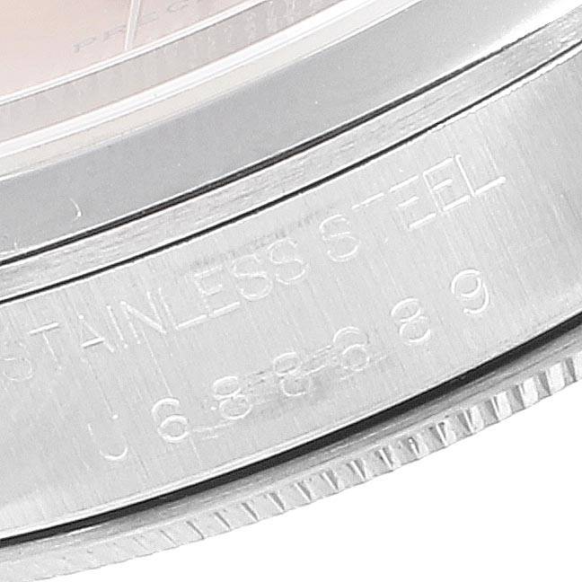 This image shows a close-up of the engraved stainless steel casing of a Rolex Air-King 14000 Men's Stainless Steel Pink Dial 14000 Men's Stainless Steel Pink Dial watch.