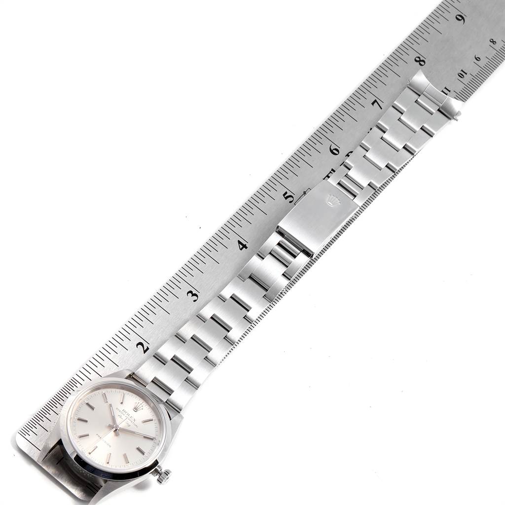 The image shows the Rolex Air-King 14000 Men's Stainless Steel Silver Dial 14000 Men's Stainless Steel Silver Dial watch laid flat with a ruler measuring its strap length.