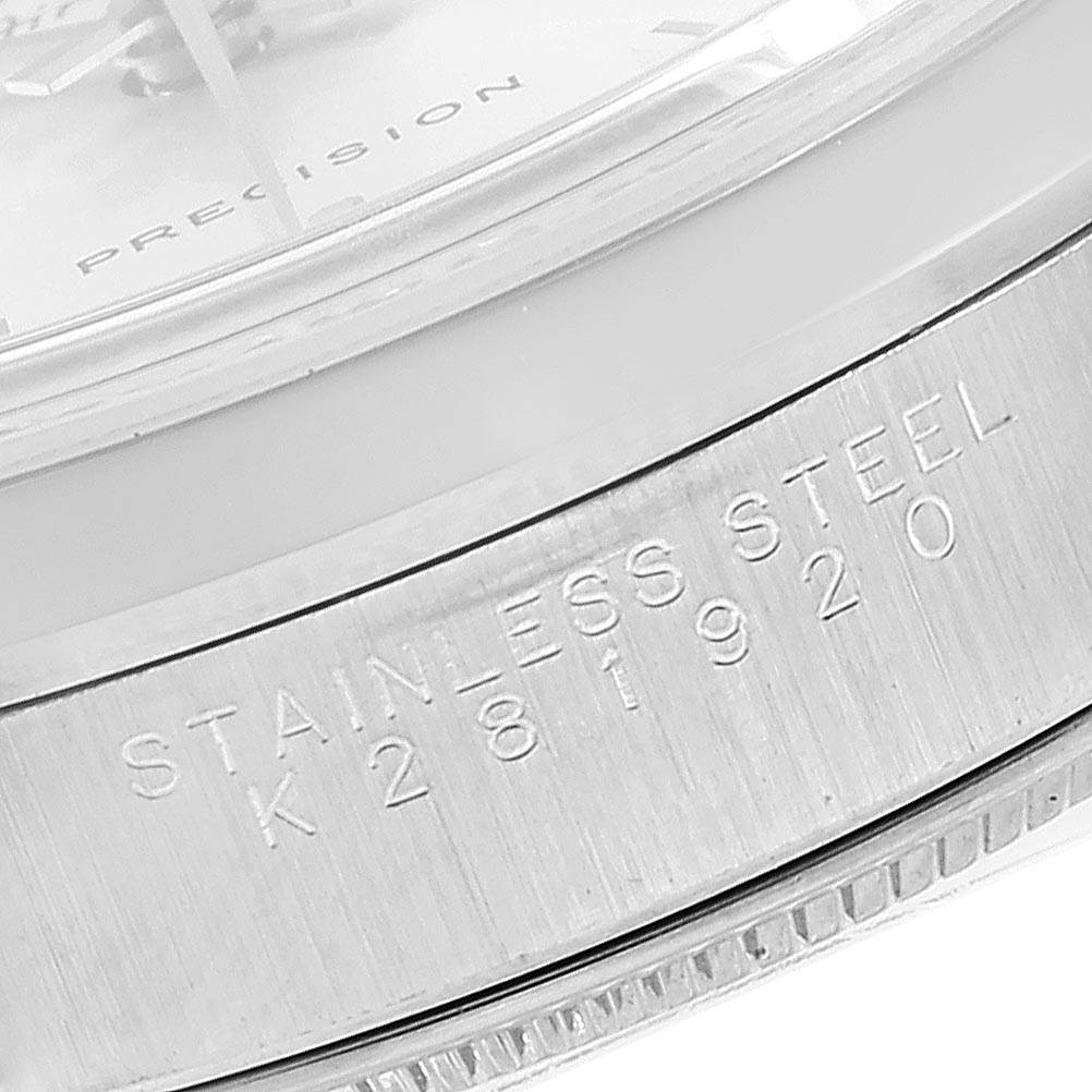 This close-up angle shows the stainless steel bezel and part of the dial of a Rolex Air-King 14000 Men's Stainless Steel Silver Dial 14000 Men's Stainless Steel Silver Dial watch.